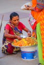 Woman selling food by Man Sagar Lake in Jaipur, India.