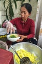 A woman selling foods on street in Hoi an, Vietnam Royalty Free Stock Photo