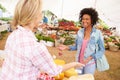 Woman Selling Fresh Cheese At Farmers Food Market