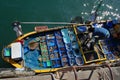 Woman selling fresh fish from her boat