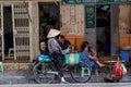 Woman is selling fruits from bicycle on the street. Royalty Free Stock Photo