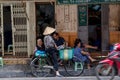 Woman is selling fruits from bicycle on the street. Royalty Free Stock Photo