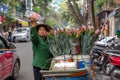 Woman is selling fruits from bicycle on the street. Royalty Free Stock Photo