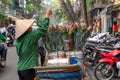 Woman is selling fruits from bicycle on the street. Royalty Free Stock Photo