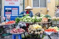 Woman is selling fruits from bicycle on the street. Royalty Free Stock Photo