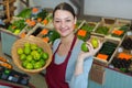 woman selling green lemons Royalty Free Stock Photo