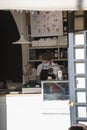 Woman selling ice cream with medical mask at the shop checkout