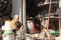 Woman selling kitchen utensils