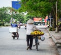 A woman selling local fruits on the street Royalty Free Stock Photo