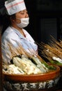 A woman selling local Sichuan street food on Jinli Street, Chengdu