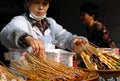 A woman selling local Sichuan street food on Jinli Street, Chengdu