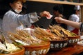 A woman selling local Sichuan street food on Jinli Street, Chengdu