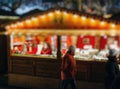 Woman selling miniature homes at Christmas Market Royalty Free Stock Photo