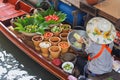 A woman selling Papaya salad