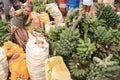 A woman selling potatoes and banana on Timor