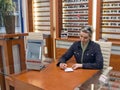 Woman selling spectacles. Royalty Free Stock Photo