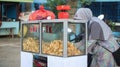 A woman selling sweet potato chips