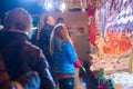 Woman selling traditional sweets in stall in the Christmas market in Vienna. on December in Vienna.