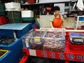 A woman sells live fish at Busan`s Jagalchi Market