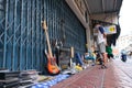 Woman sells miscellaneous items on the sidewalk