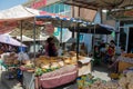 Woman sells traditional round bread at the asian market in Kyzgyzstan