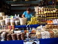 A woman sells a variety of local food