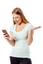 Woman sending a sms on cell phone, isolated on white. Royalty Free Stock Photo