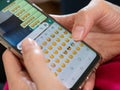 Woman sends emoticons on an instant messaging application Royalty Free Stock Photo