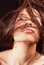 Woman with sensual lips and hair in motion