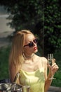 Woman with sensual red lips drink champagne in outdoor cafe Royalty Free Stock Photo