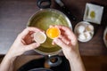 Woman separate egg yolks and whites for culinary