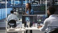 Woman in server hub using AI visualization insights on tablet device Royalty Free Stock Photo