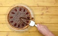 Woman serves a slice of pecan pie Royalty Free Stock Photo