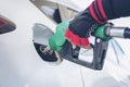 Woman service staff Handle pumping gasoline fuel nozzle to refuel Royalty Free Stock Photo