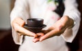 Woman serving Chinese tea in a tea ceremony Royalty Free Stock Photo