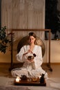 Woman serving Chinese tea in a traditional tea ceremony with Tibetan Singing Bowl Royalty Free Stock Photo