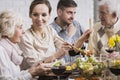 Woman serving dinner to her family Royalty Free Stock Photo