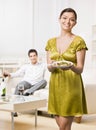 Woman serving elegant dinner to husband