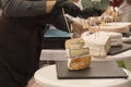 Woman Serving Fresh Cheese At Farmers Food Market Royalty Free Stock Photo