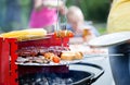 Woman serving grilled skewers