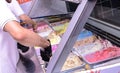 Woman serving ice cream in Confectionery shop