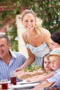 Woman Serving At Multi Generation Family Meal Royalty Free Stock Photo