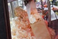 Woman serving potato snack chips during country fair, food festival or carnival in a paper bag