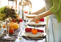 Woman serving pumpkin pie at the Thanksgiving party