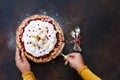 Woman serving a slice of holiday cranberry tart