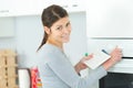 woman setting kitchen oven Royalty Free Stock Photo
