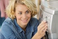 woman setting washing machine programme Royalty Free Stock Photo