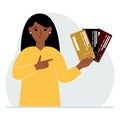 A woman with several plastic cards. The concept of multiple loans, the burden of credit cards and banking fees over a