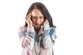 A woman with a severe migraine holds her head with her hands in painful places Royalty Free Stock Photo