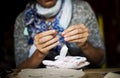 Woman sewing handmade doll on the table Royalty Free Stock Photo
